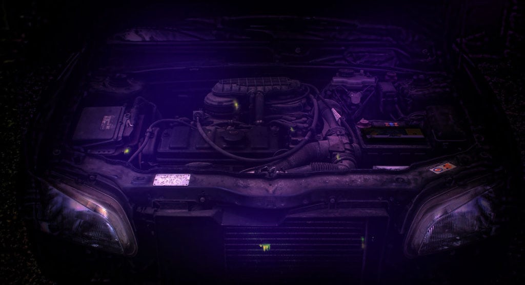 Automotive revealing all leaks using fluorescent dye and UV lamp.