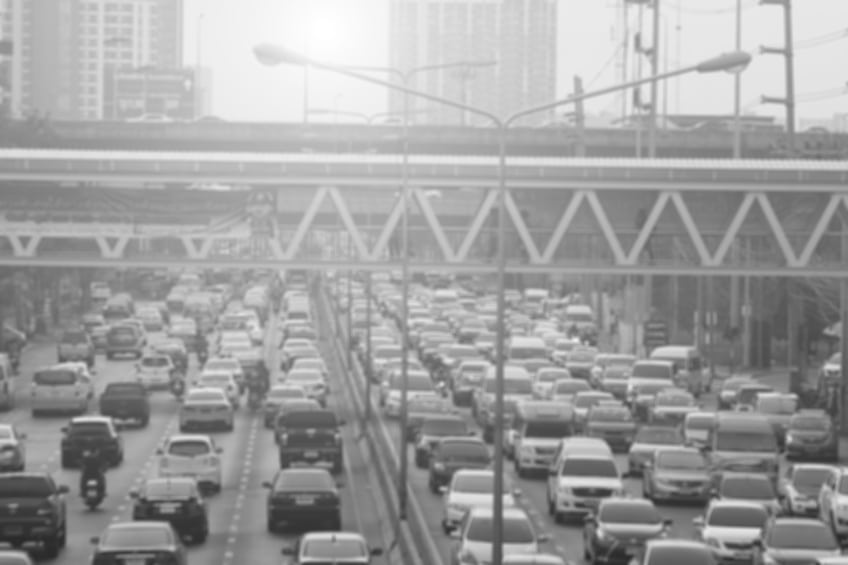 blurred traffic jam with smog on the road in bangkok , Thailand , black & white